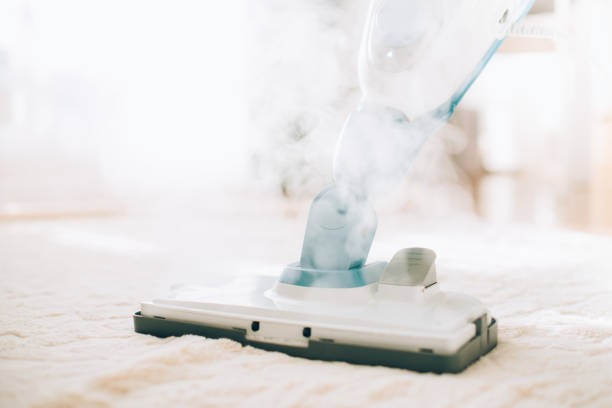 Cleaning the floor with steam cleaner. Banner and copy space. Cleaning service concept.