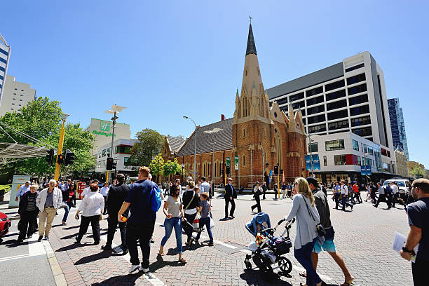 Large group of tourists in the willian streets of Perth city.