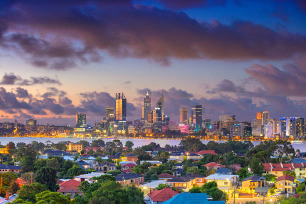 Aerial cityscape image of Perth skyline, Australia during dramatic sunset.