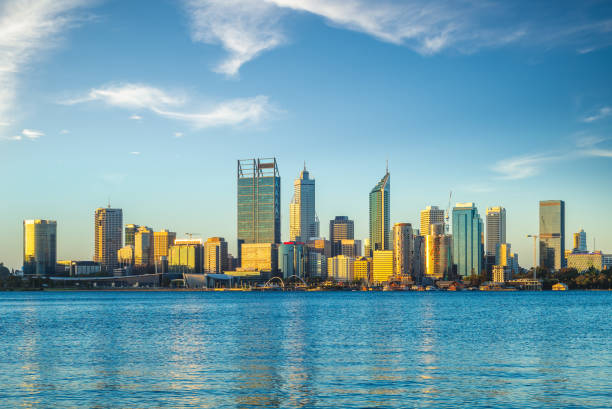 skyline of perth at dusk by swan river in western australia