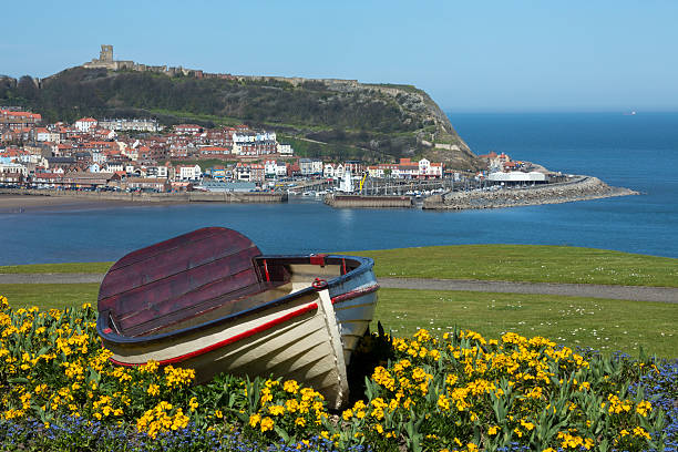 Scarborough Castle on a hillside above the town and harbor -