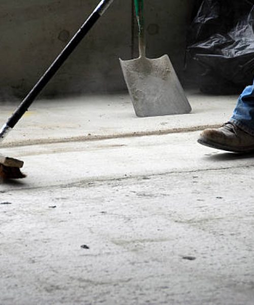 worker gathering the rubbish out of apartment