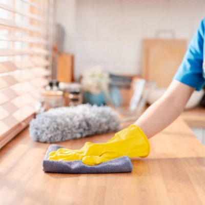 House keeping service female cleaning dust in house with professional equipments.